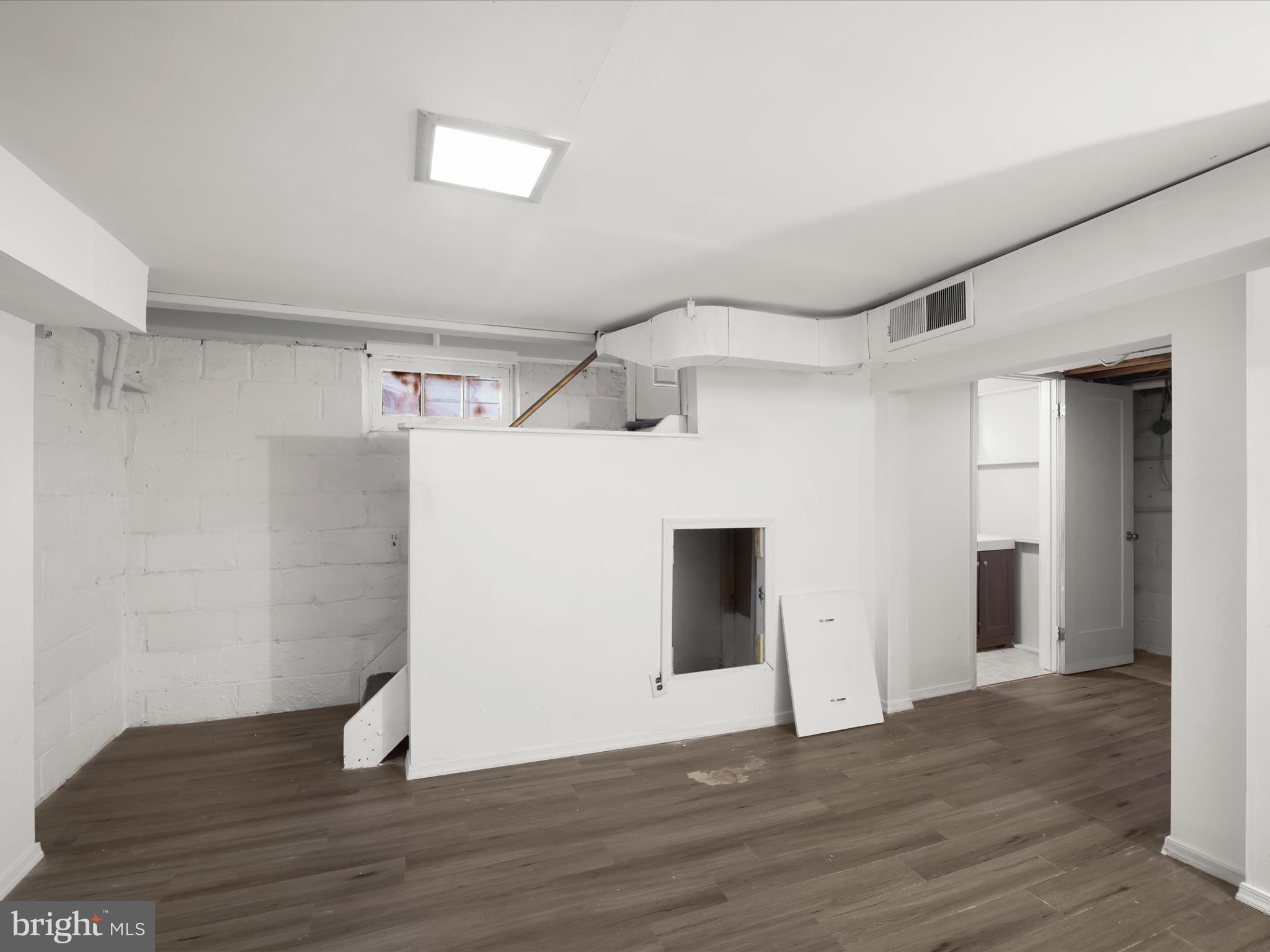 5545 Bass Place Southeast Washington, DC 20019 - Photo 21 of 35 a view of an empty room with wooden floor