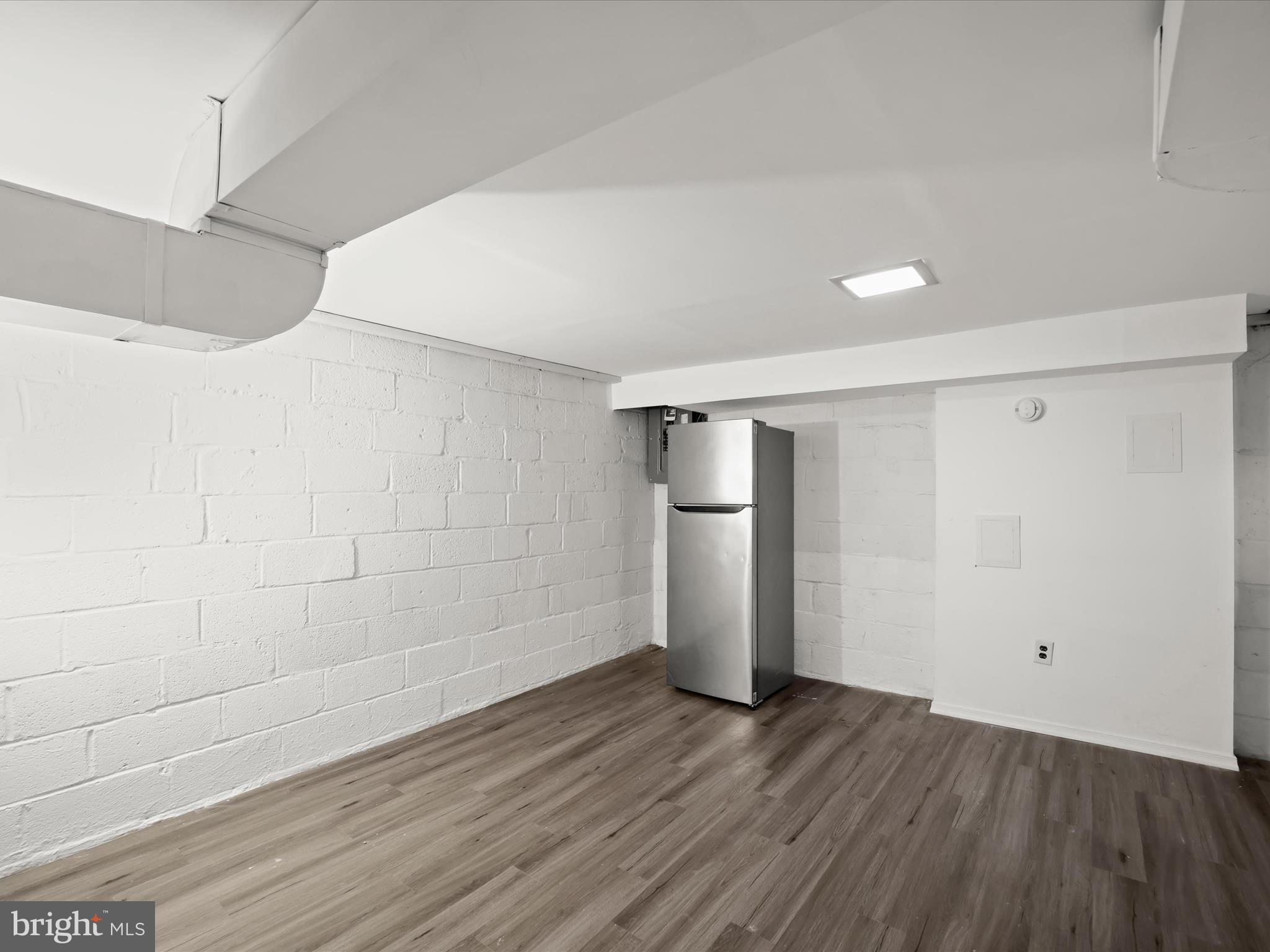 5545 Bass Place Southeast Washington, DC 20019 - Photo 22 of 35 a view of empty room with wooden floor