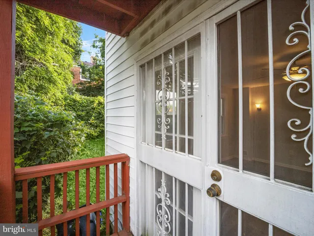 a view of a porch with a small yard