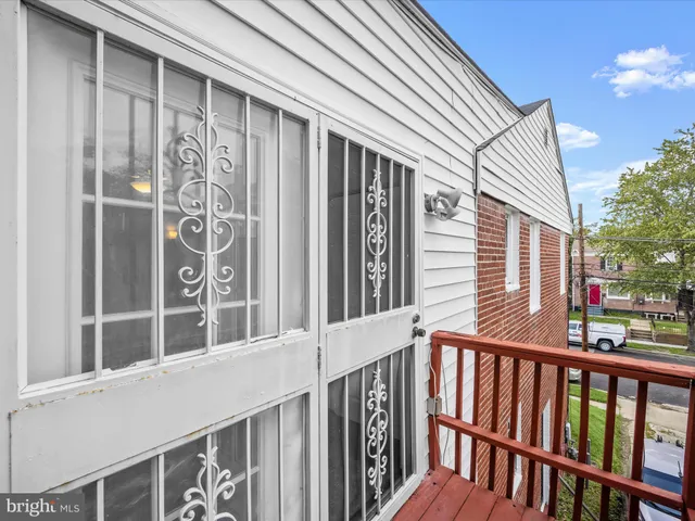 a view of a brick house with a large window