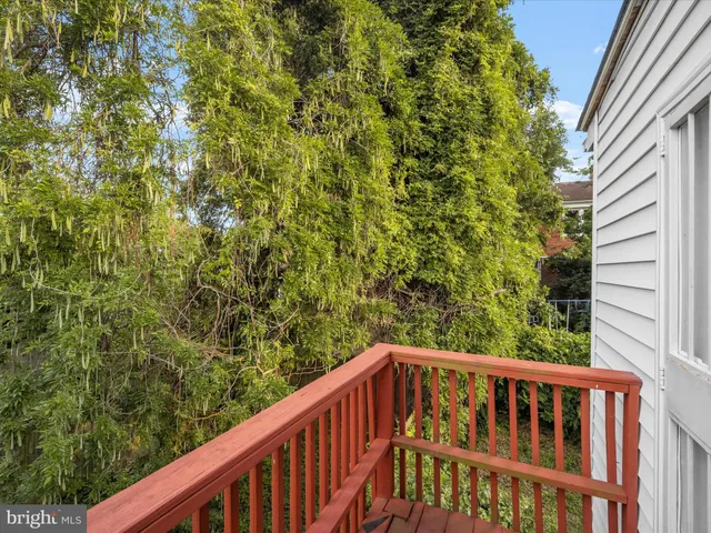a view of balcony with wooden floor
