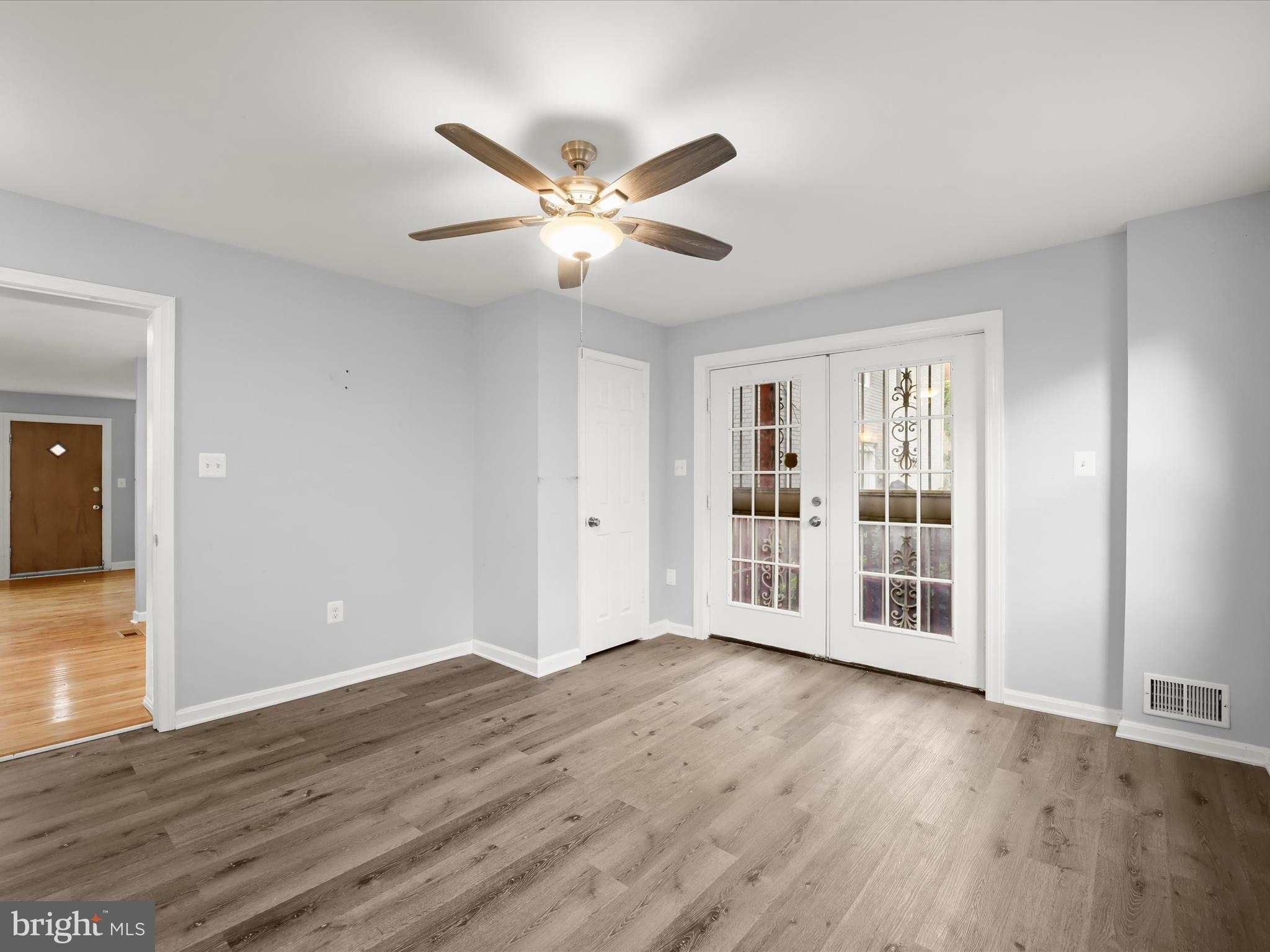 5545 Bass Place Southeast Washington, DC 20019 - Photo 8 of 35 a view of an empty room with wooden floor and a window
