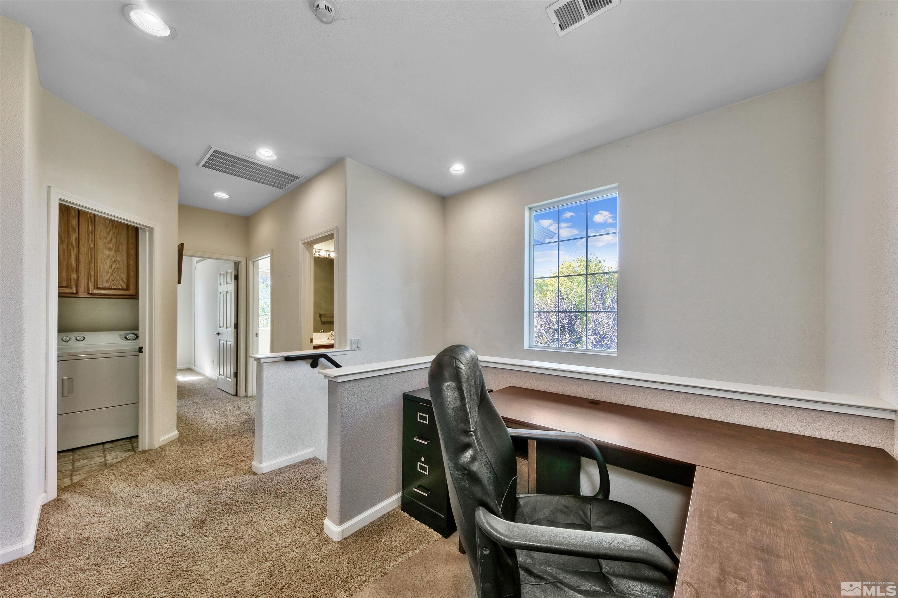 1875 Resistol Drive Reno, NV 89521 - Photo 18 of 25 a view of a livingroom with furniture and windows