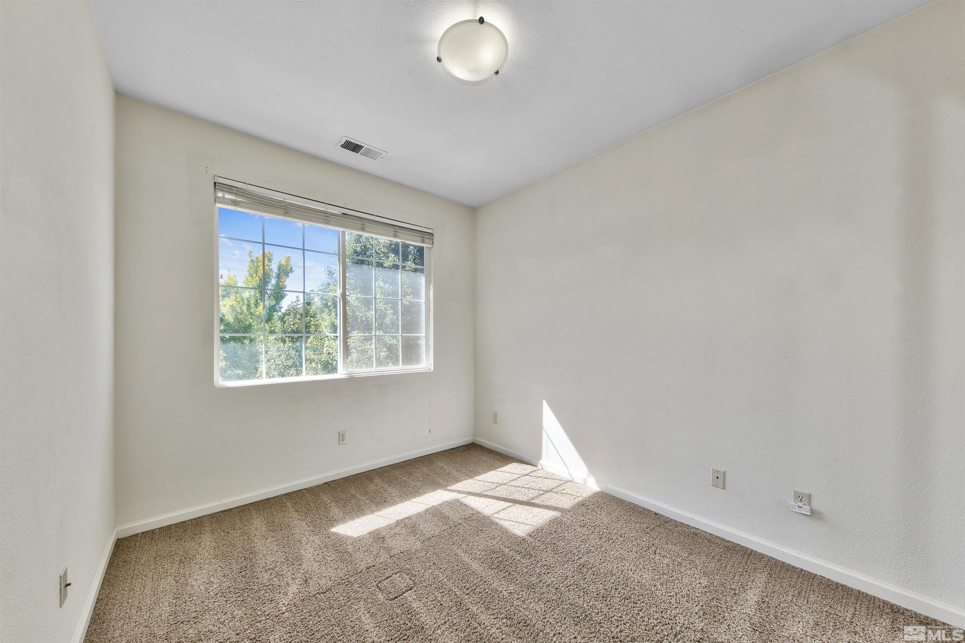 1875 Resistol Drive Reno, NV 89521 - Photo 20 of 25 an empty room with a window