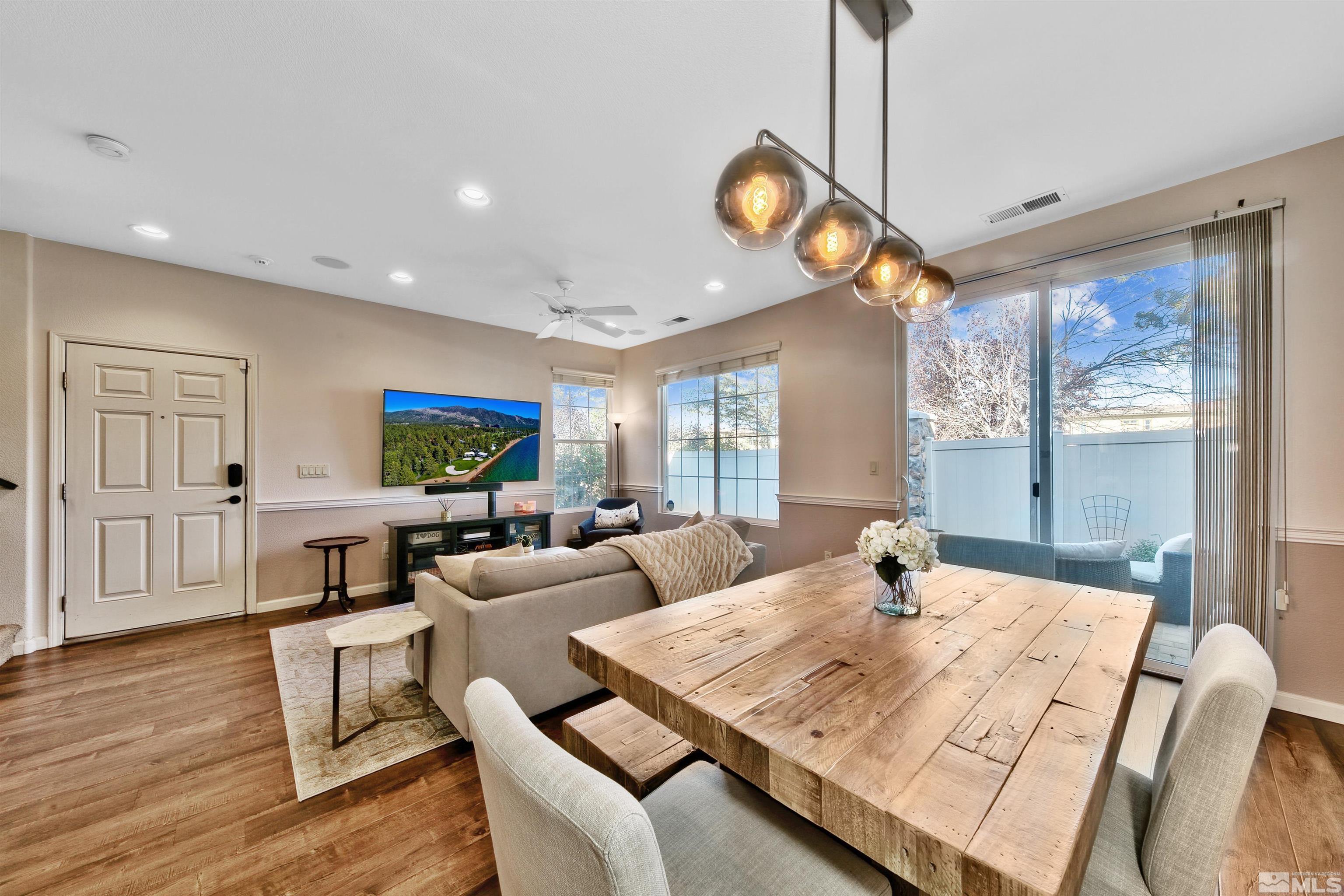 1875 Resistol Drive Reno, NV 89521 - Photo 6 of 25 a view of a dining room with furniture window and wooden floor