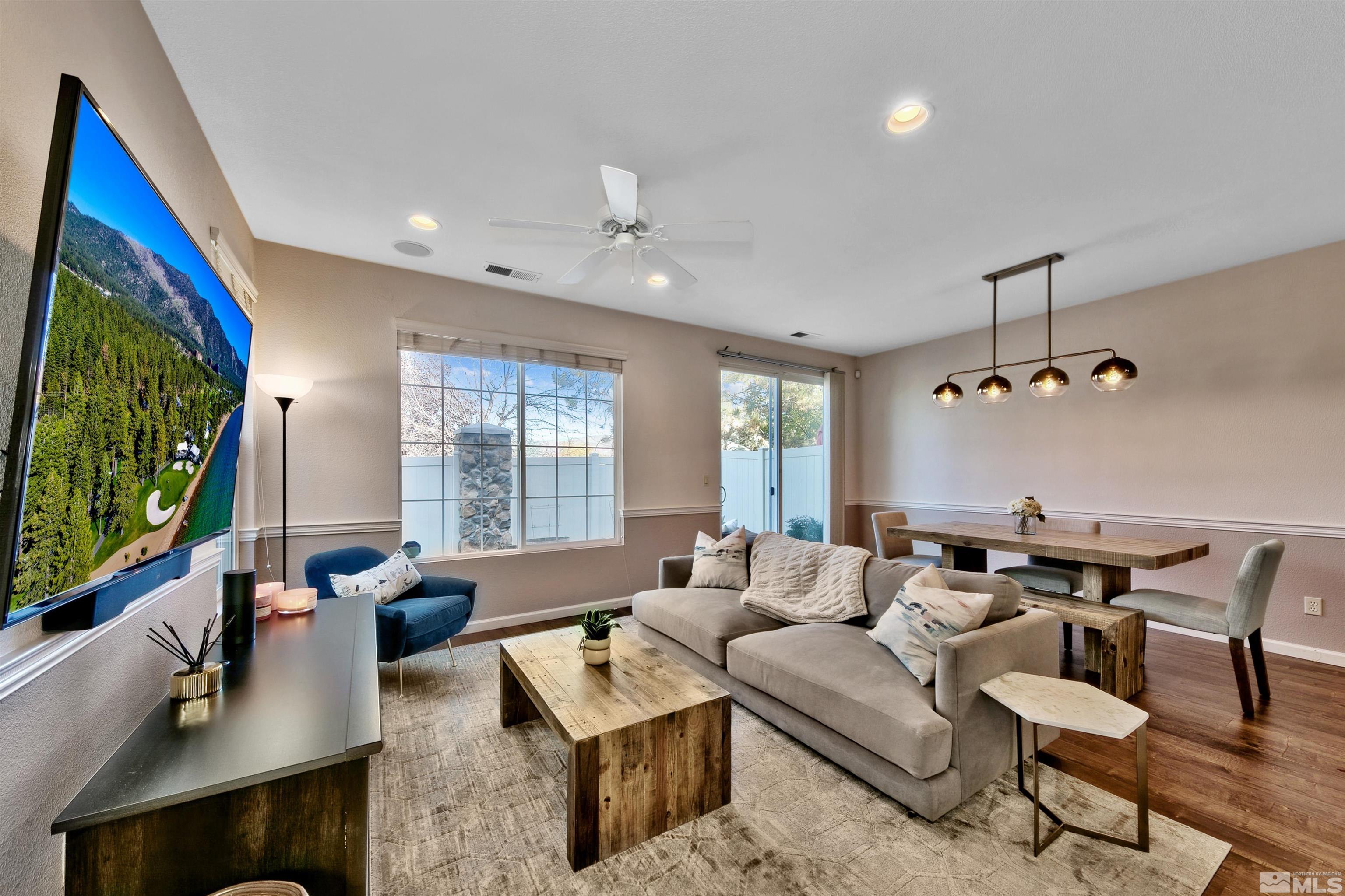 1875 Resistol Drive Reno, NV 89521 - Photo 8 of 25 a living room with furniture and a flat screen tv
