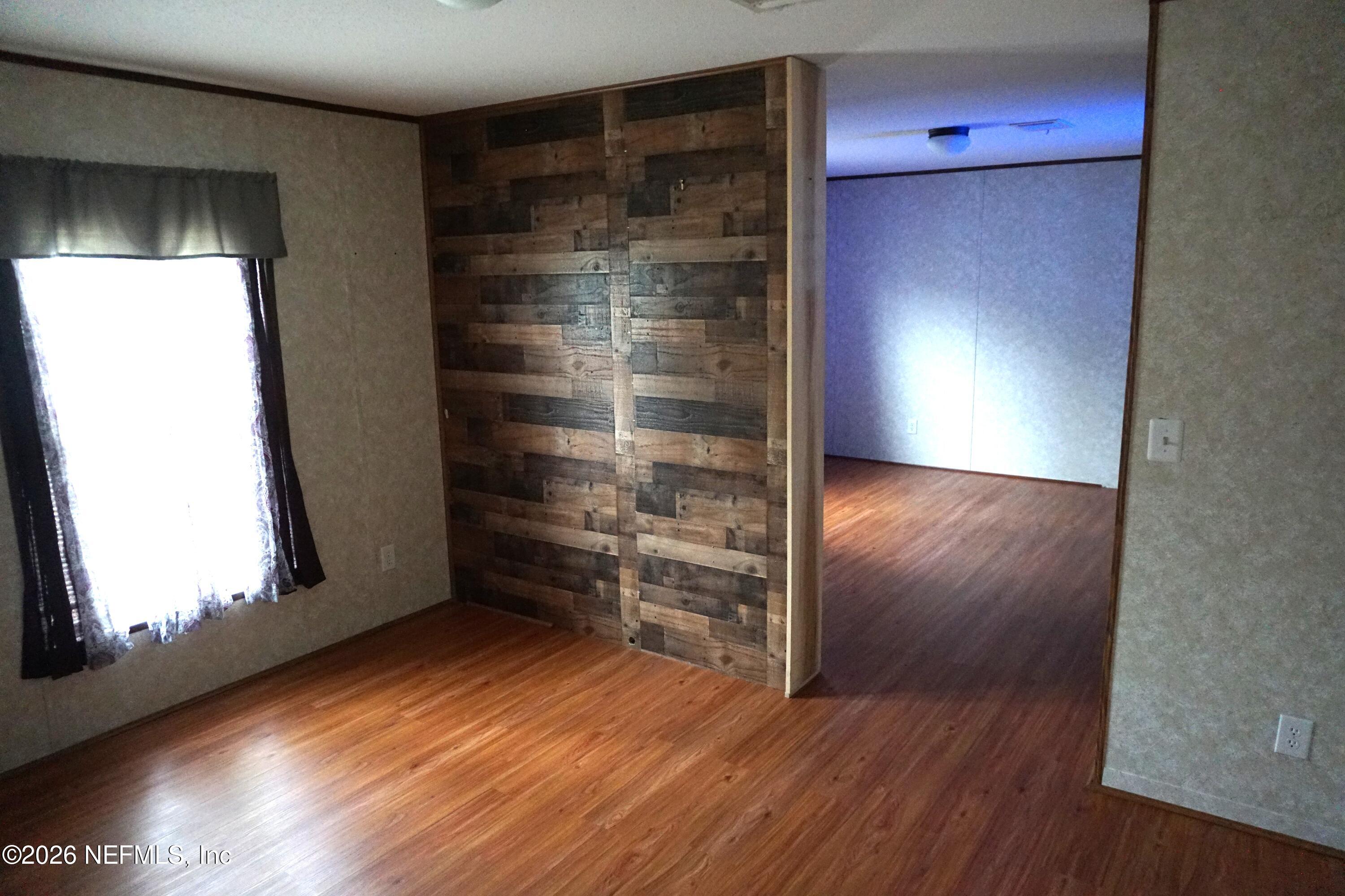 12240 Northwest 225th Road, Unit COUNTY Starke, FL 32091 - Photo 12 of 19 Sitting Room to Master Suite