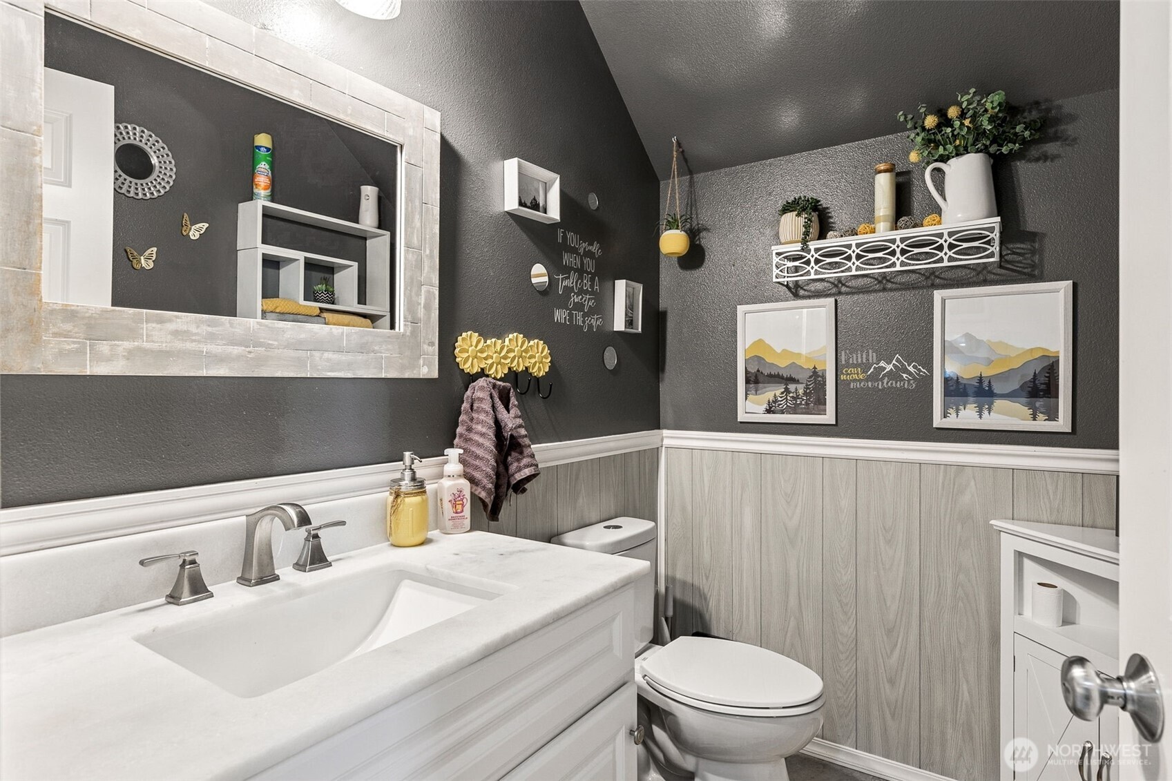 7074 Inlay Street Southeast Lacey, WA 98513 - Photo 13 of 28 a bathroom with a sink a toilet and a mirror