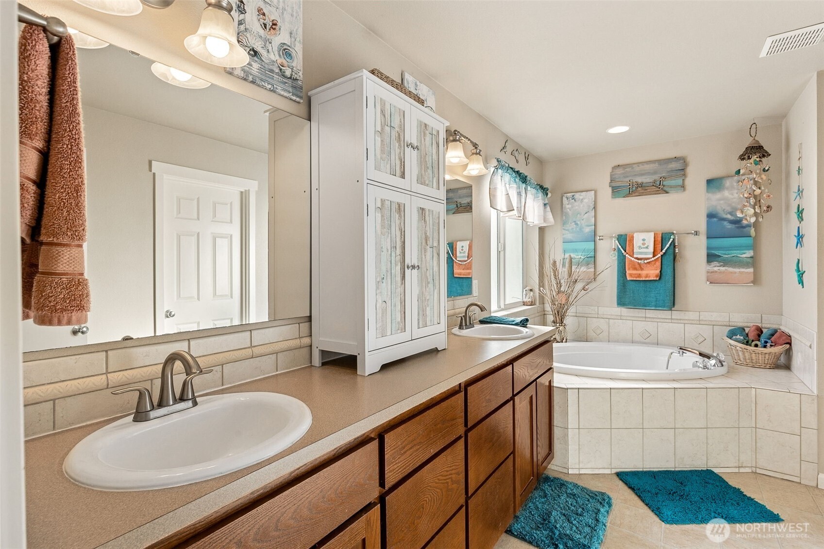 7074 Inlay Street Southeast Lacey, WA 98513 - Photo 16 of 28 a bathroom with a sink double vanity granite tub shower and a mirror