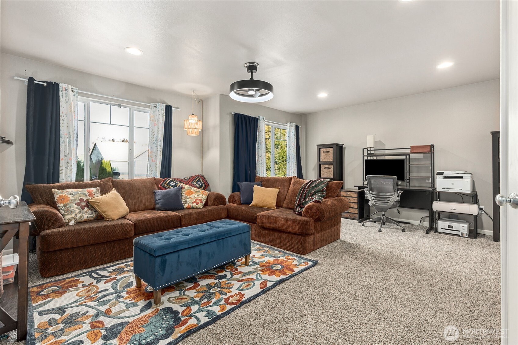 7074 Inlay Street Southeast Lacey, WA 98513 - Photo 18 of 28 a living room with furniture and a flat screen tv