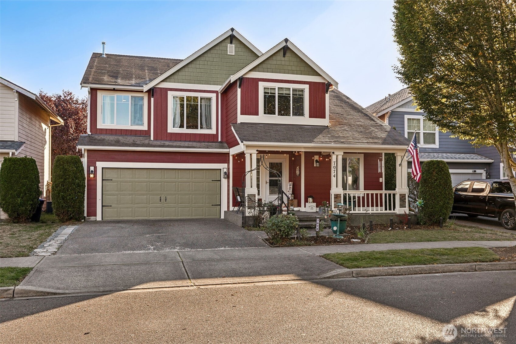 7074 Inlay Street Southeast Lacey, WA 98513 - Photo 2 of 28 a front view of a house with garden