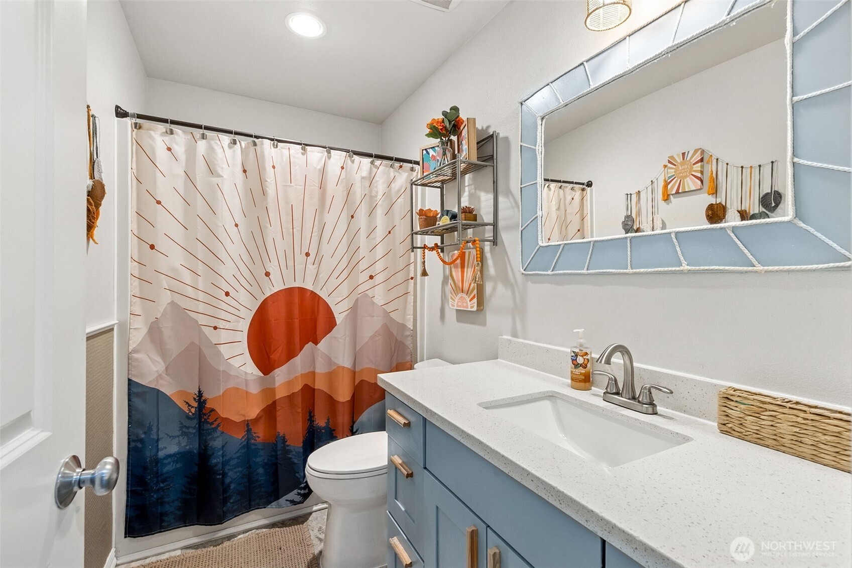 7074 Inlay Street Southeast Lacey, WA 98513 - Photo 21 of 28 a bathroom with a sink a toilet and a mirror