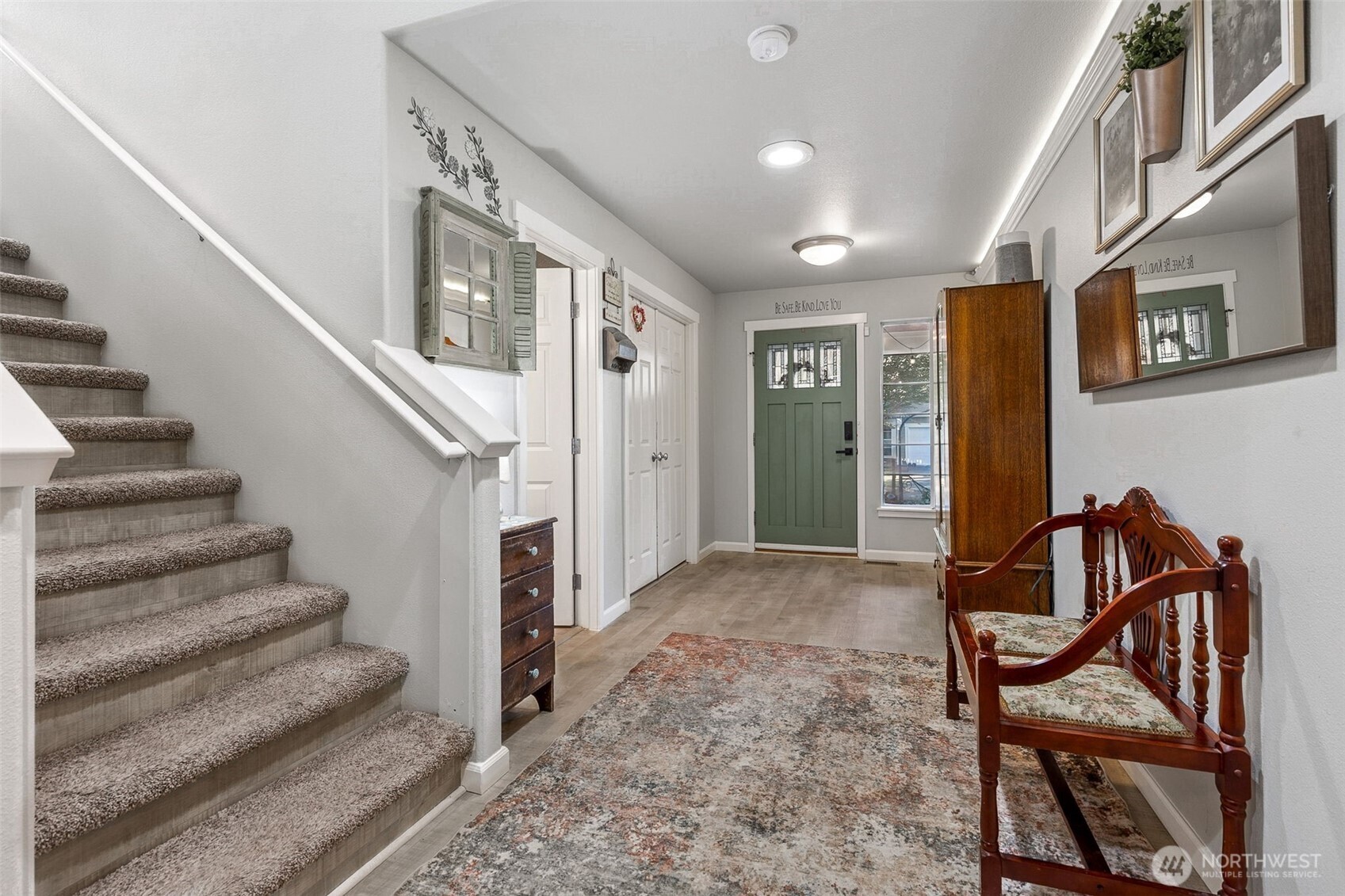 7074 Inlay Street Southeast Lacey, WA 98513 - Photo 4 of 28 a view of a hallway with wooden floor and stairs