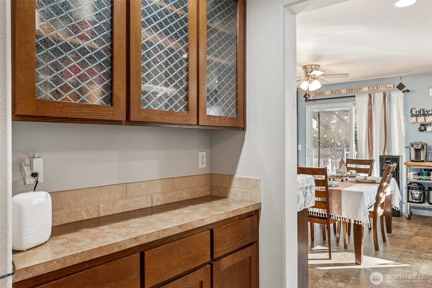 7074 Inlay Street Southeast Lacey, WA 98513 - Photo 10 of 28 a kitchen with a sink and cabinets