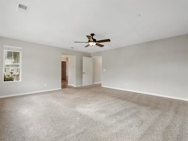 a large bathroom with a tub and shower