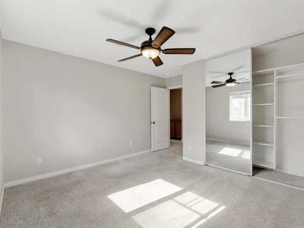 a view of storage and utility room with closet