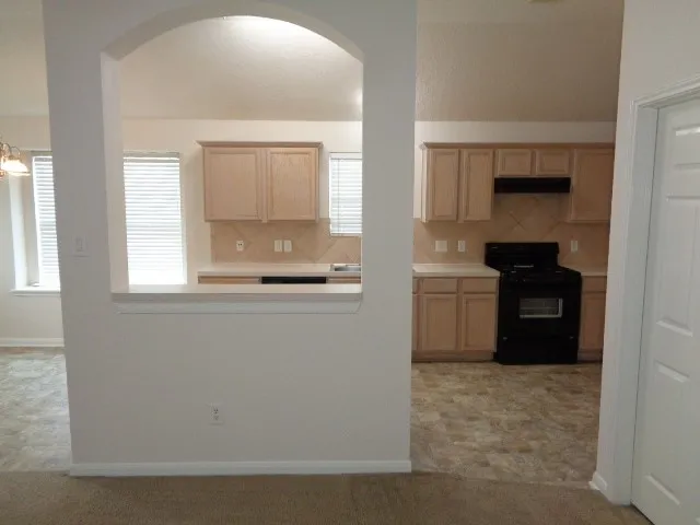 a white toilet sitting next to a bath tub