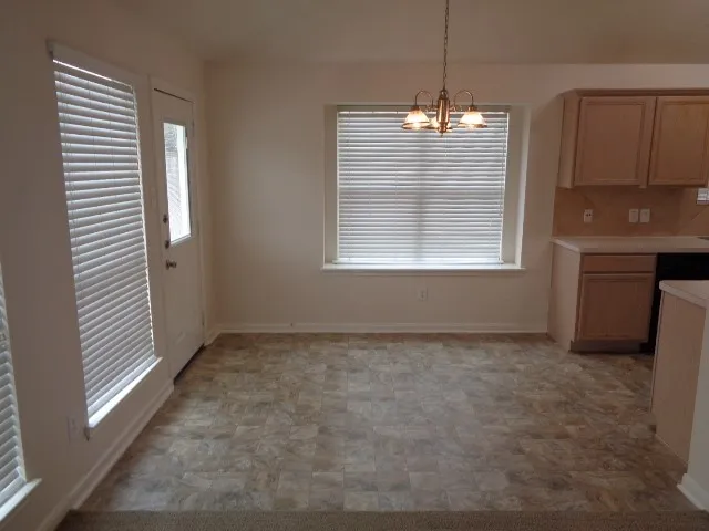 a utility room with sink dryer and washer