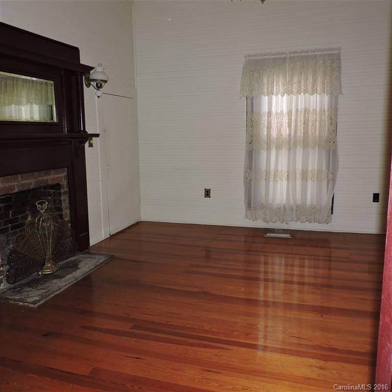 6696 Shiloh Unity Road Lancaster, SC 29720 - Photo 14 of 22 a view of empty room with window and fireplace