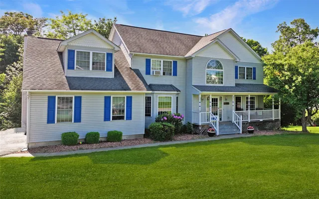 a front view of a house with a yard