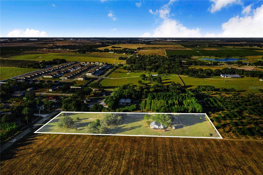 1114 H L Smith Road Haines City, FL 33844 - Photo 5 of 21 a view of a swimming pool and an outdoor seating