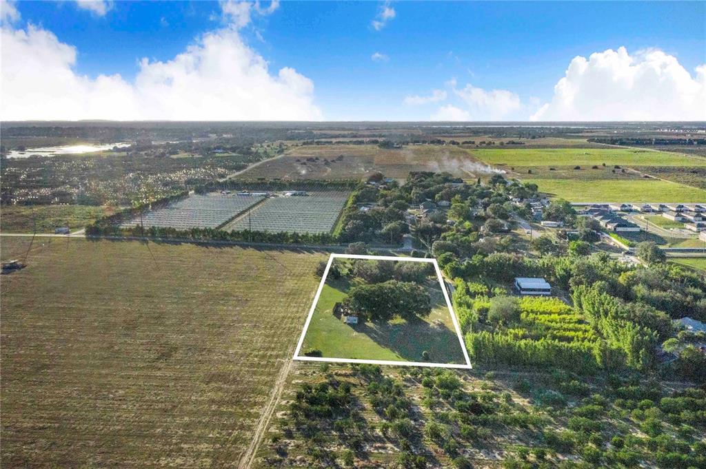 1114 H L Smith Road Haines City, FL 33844 - Photo 7 of 21 a view of a lake with a big yard