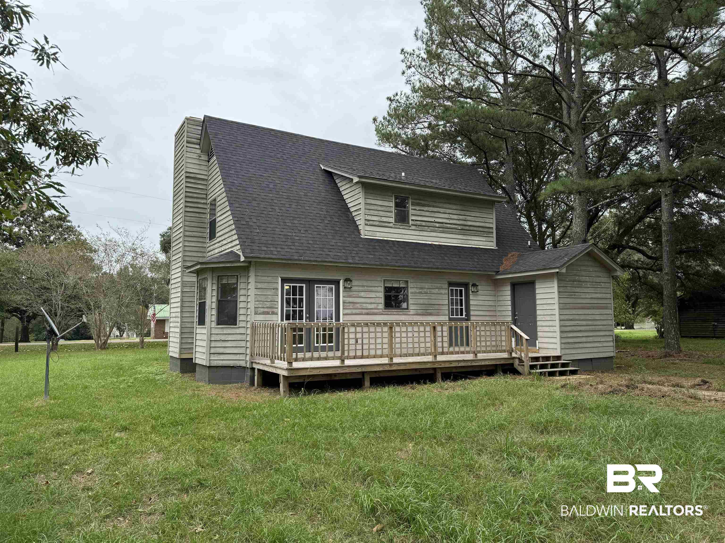 70 Plum Street Uriah, AL 36480 - Photo 31 of 36 Back of property featuring a yard and a wooden deck