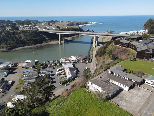 an aerial view of a house with a lake view