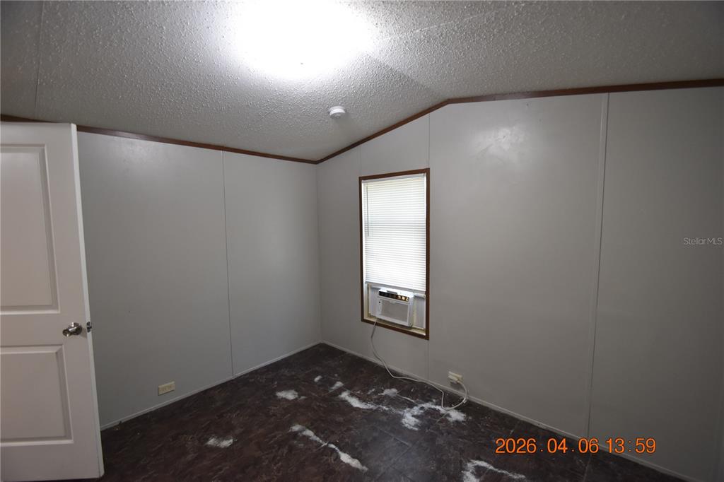 7515 Symmes Road, Unit LOT #5 Gibsonton, FL 33534 - Photo 11 of 23 an empty room with windows