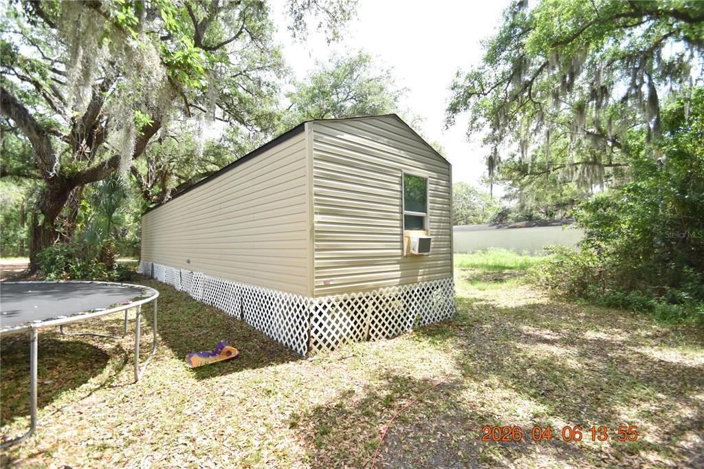 7515 Symmes Road, Unit LOT #5 Gibsonton, FL 33534 - Photo 23 of 23 a view of backyard of house