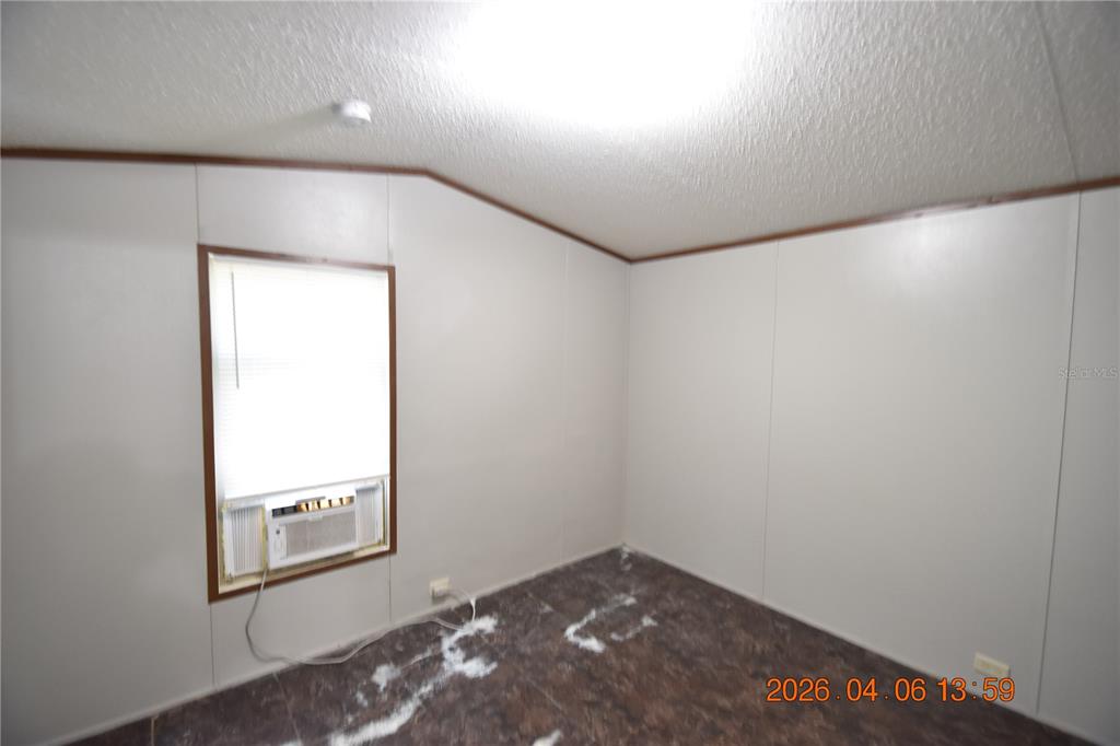 7515 Symmes Road, Unit LOT #5 Gibsonton, FL 33534 - Photo 10 of 23 an empty room with windows