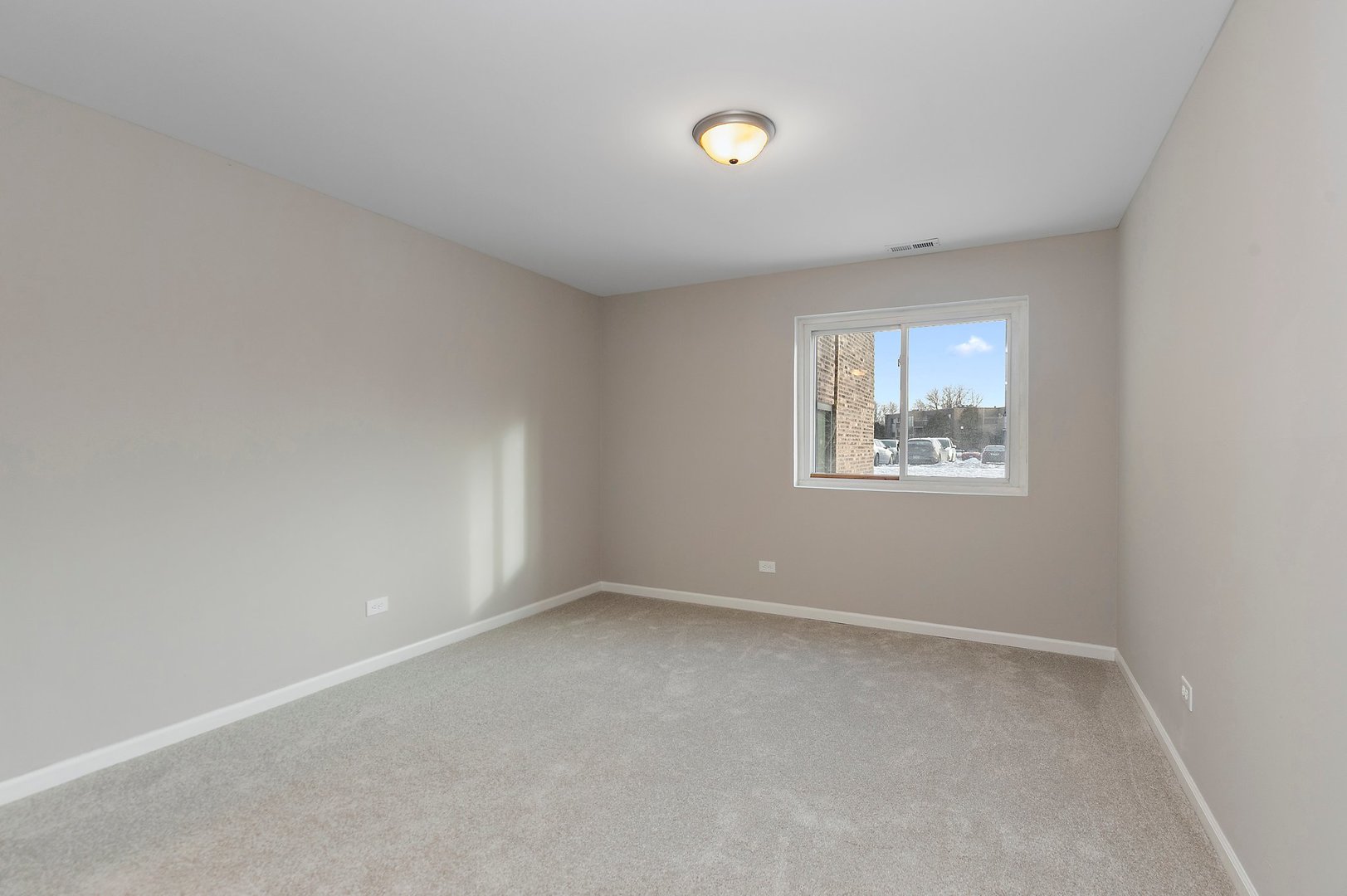 1484 Stonebridge Circle, Unit B4 Wheaton, IL 60189 - Photo 11 of 14 an empty room with windows