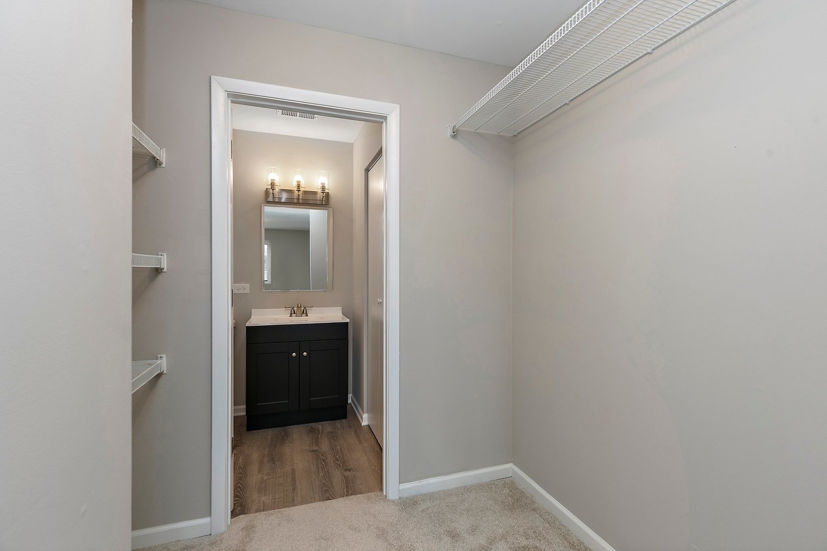 1484 Stonebridge Circle, Unit B4 Wheaton, IL 60189 - Photo 12 of 14 a view of a hallway view with wooden floor and staircase
