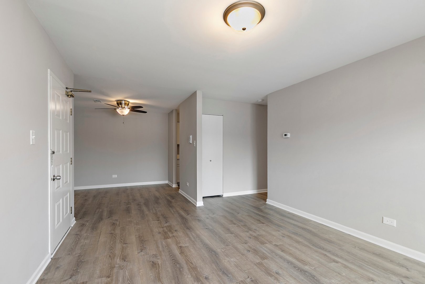 1484 Stonebridge Circle, Unit B4 Wheaton, IL 60189 - Photo 4 of 14 a view of a livingroom with wooden floor