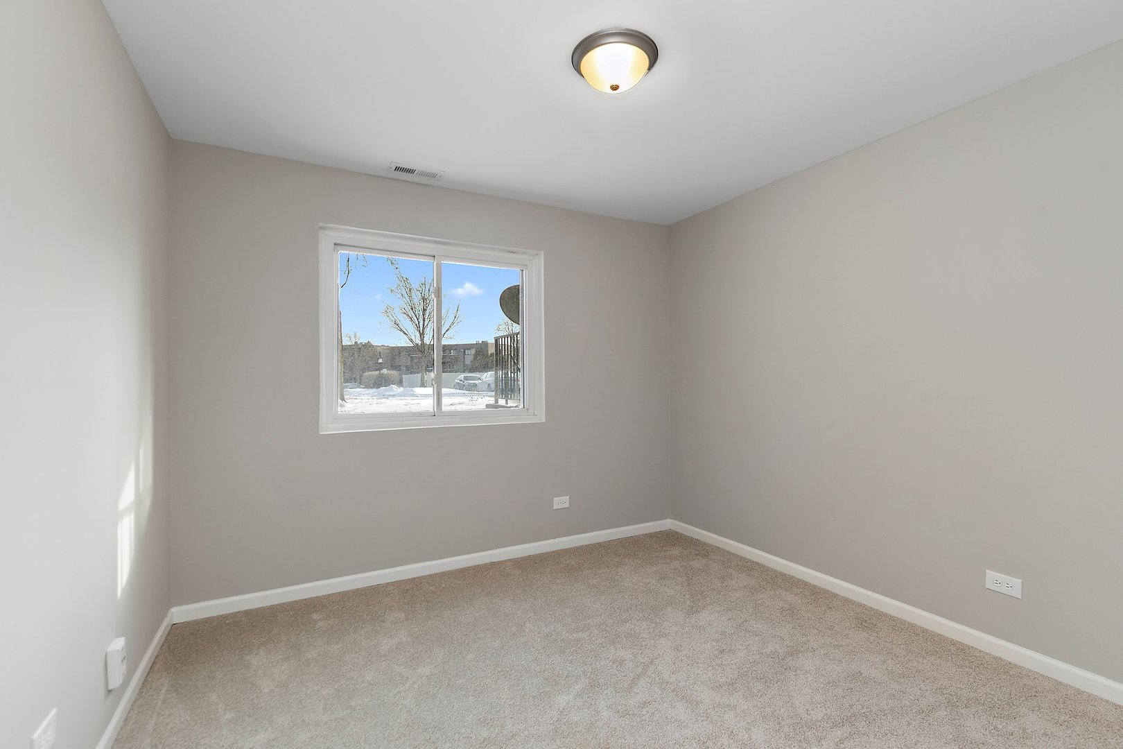 1484 Stonebridge Circle, Unit B4 Wheaton, IL 60189 - Photo 8 of 14 an empty room with a window