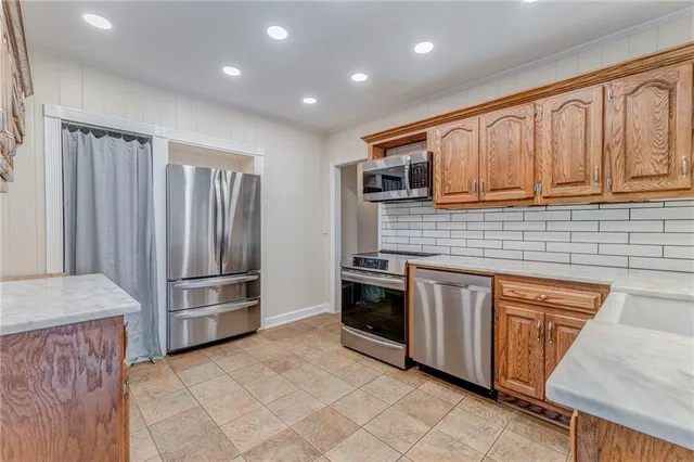 a living room with furniture a chandelier and a table
