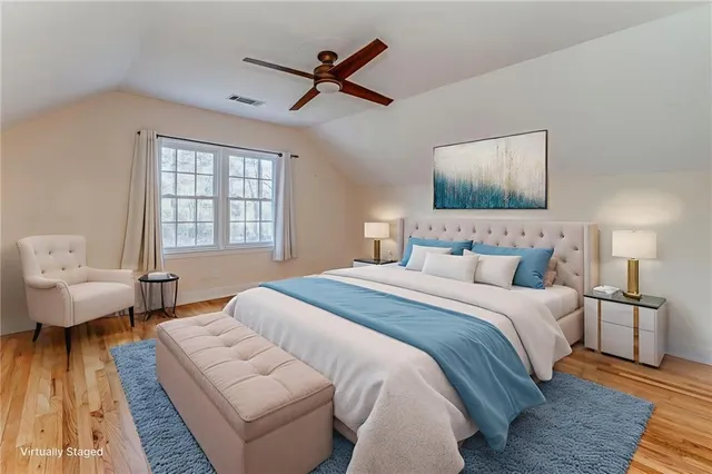 a bedroom with a bed and window