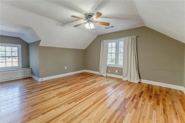 a bathroom with a tub sink and shower