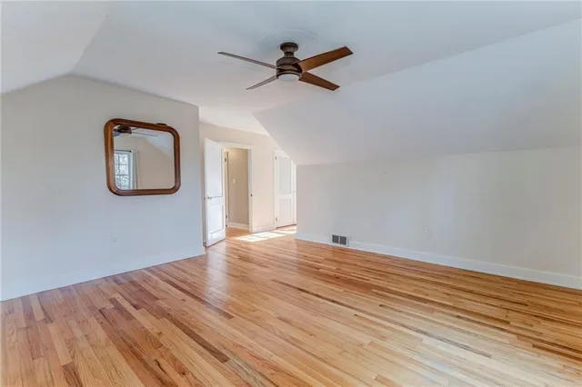 front view of a house with a tree in front