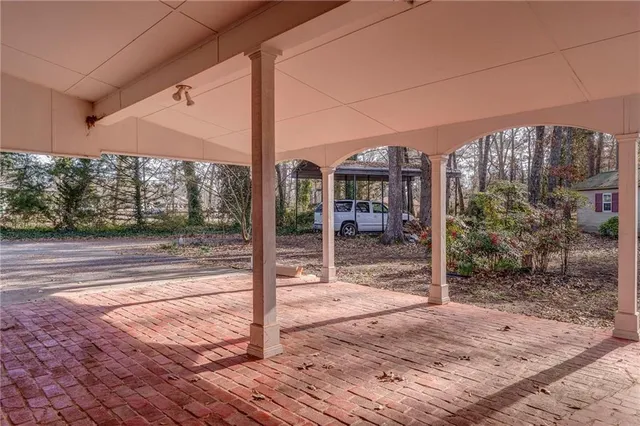 a view of a wooden door with a tree