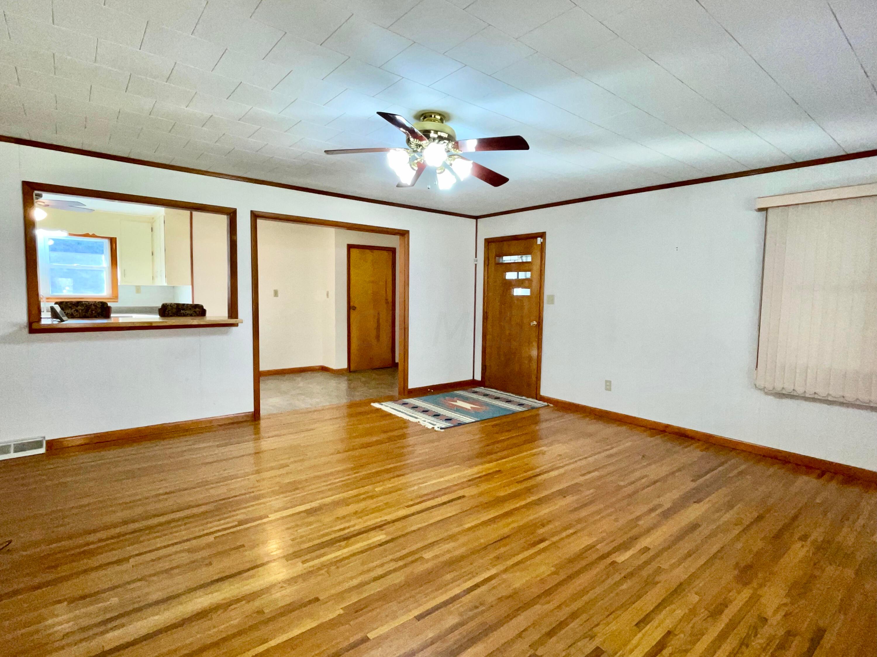 1368 Allen Road Beaver, OH 45613 - Photo 10 of 77 A view of the living room from the front door. Original hardwood floors.