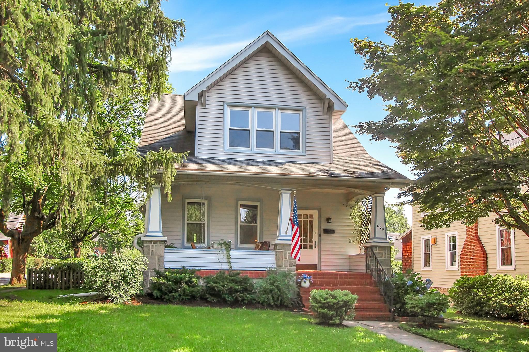 600 Murdock Road Baltimore, MD 21212 - Photo 1 of 30 a front view of a house with garden and trees