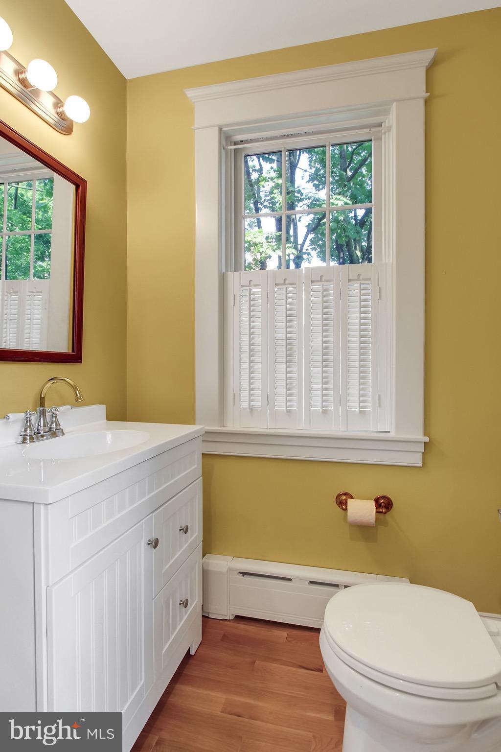600 Murdock Road Baltimore, MD 21212 - Photo 14 of 30 a bathroom with a granite countertop sink a toilet and a mirror