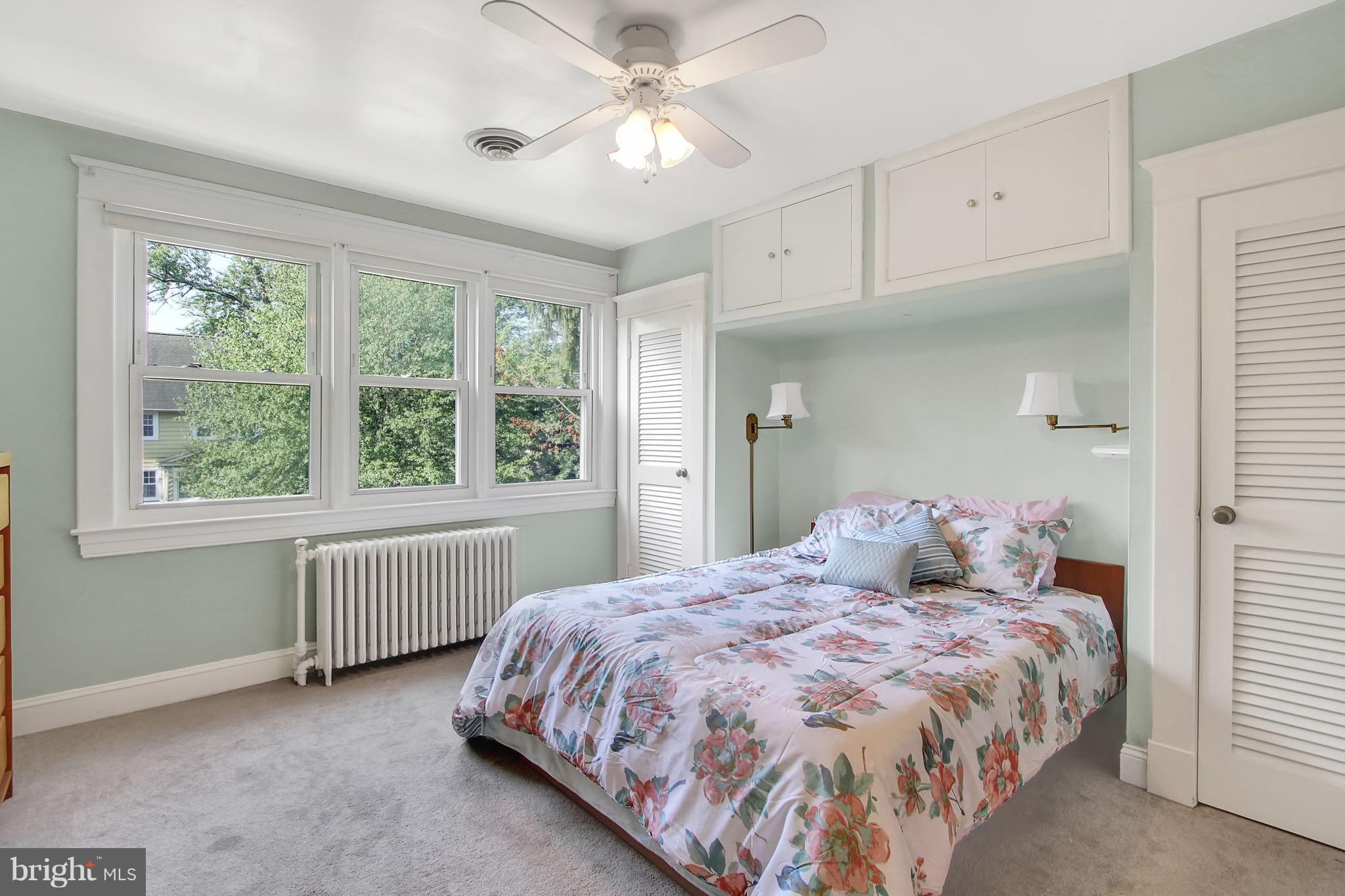 600 Murdock Road Baltimore, MD 21212 - Photo 17 of 30 a bedroom with a bed and a large window