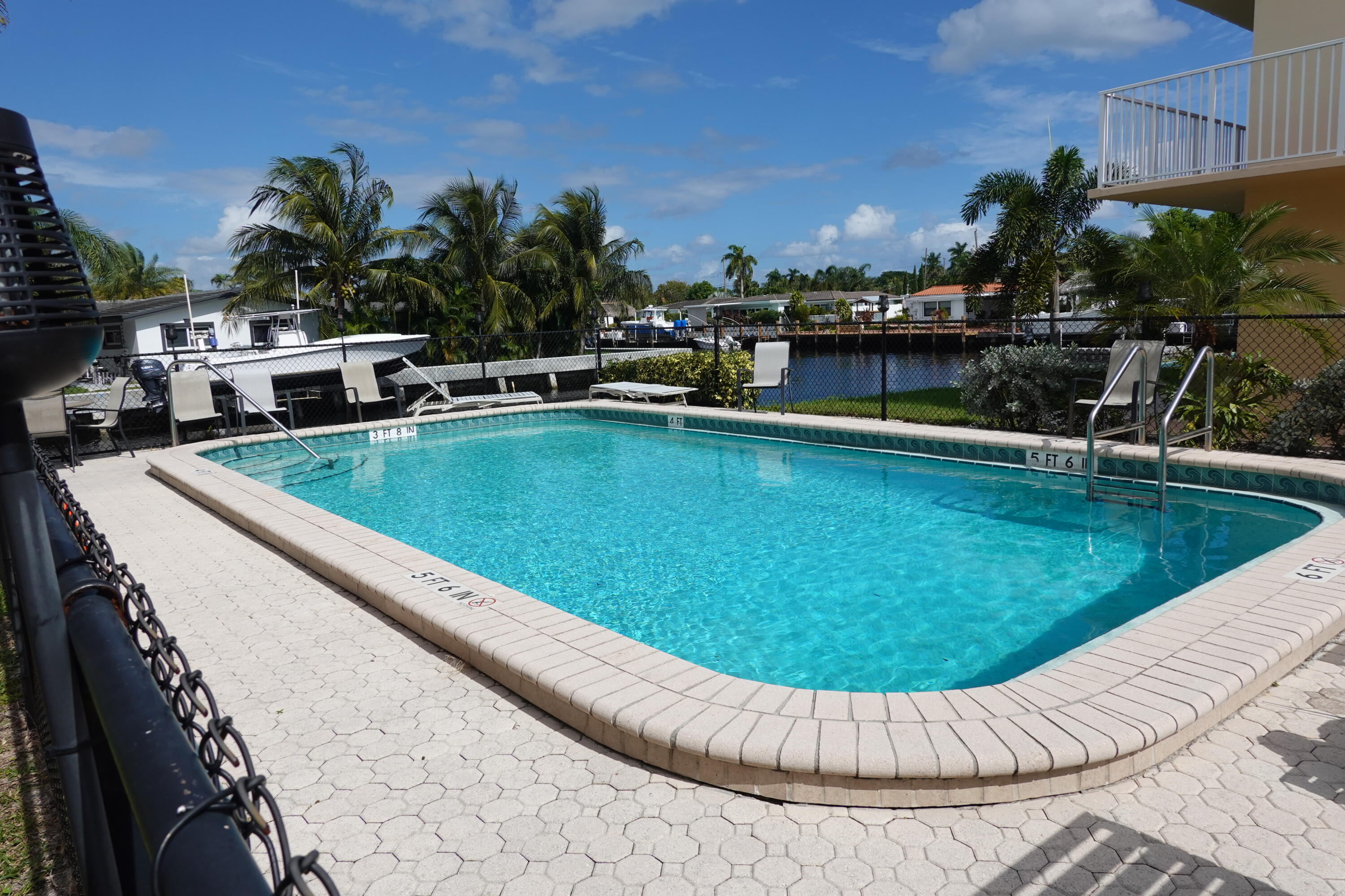 a view of a swimming pool with a lounge chair