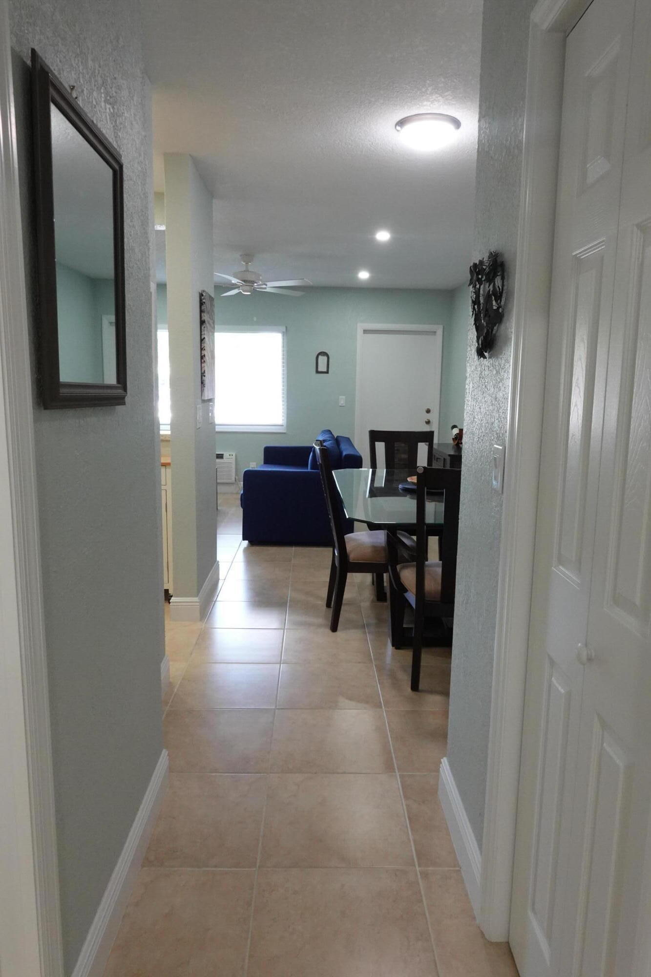 301 East McNab Road, Unit 113 Pompano Beach, FL 33060 - Photo 15 of 21 a lobby with furniture and a gate