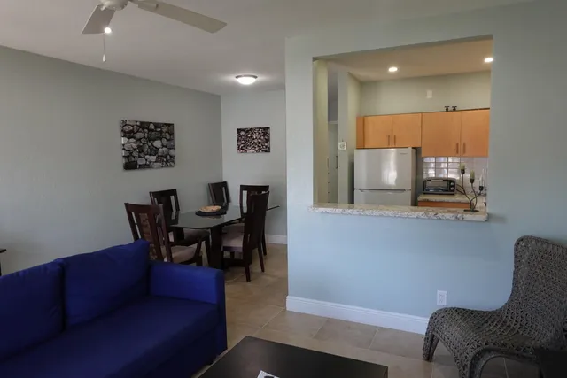 a view of kitchen with furniture and wooden floor