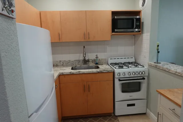a kitchen with a stove and a microwave