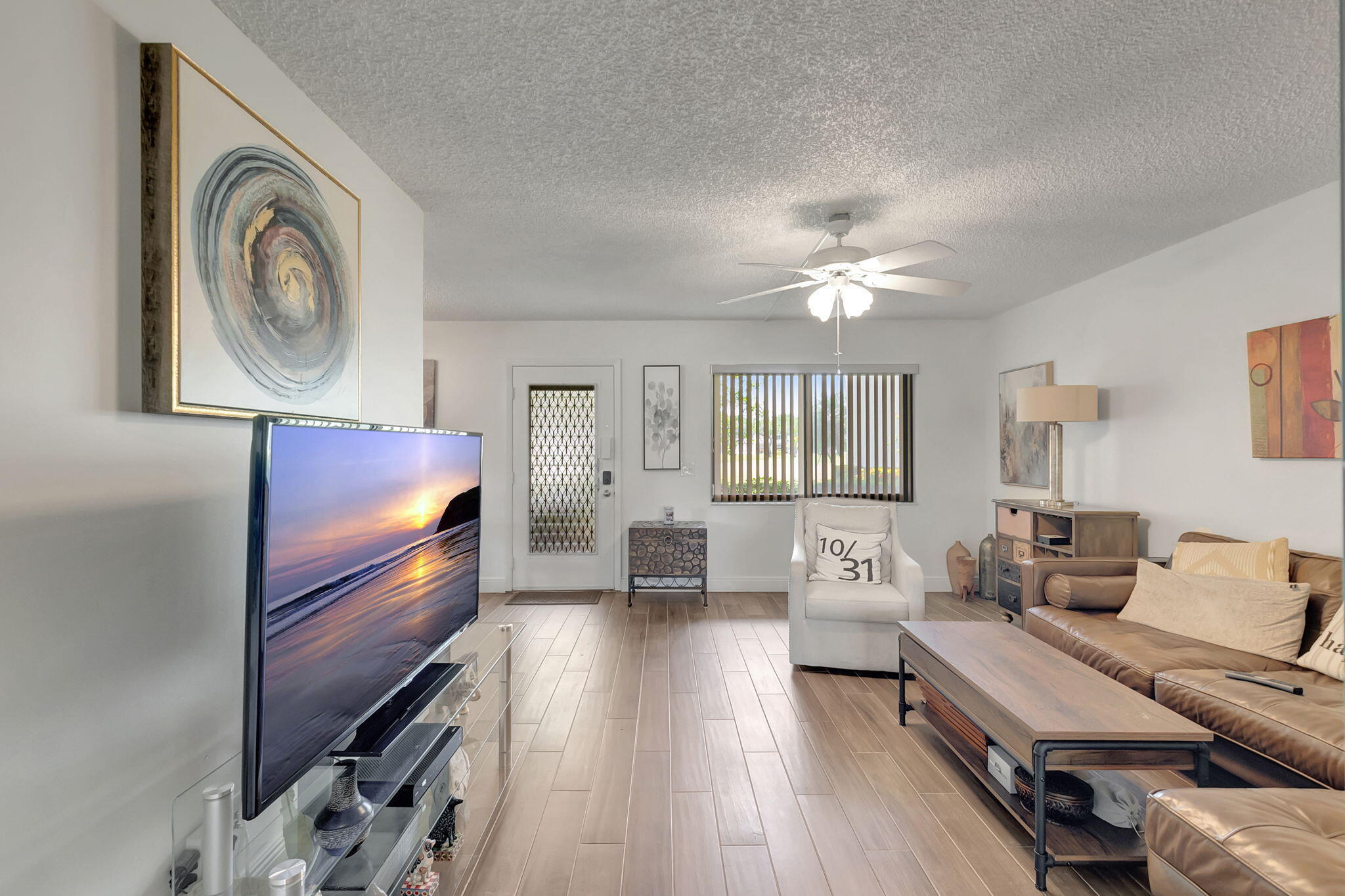 66 Capri B Delray Beach, FL 33484 - Photo 11 of 62 a living room with furniture and a large window