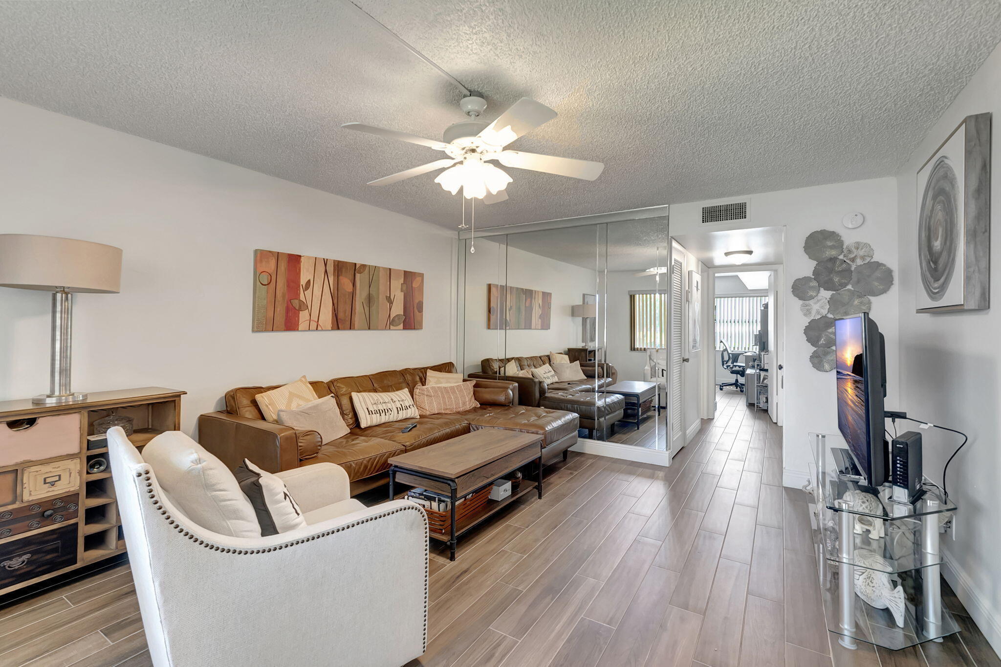 66 Capri B Delray Beach, FL 33484 - Photo 15 of 62 a living room with furniture and a wooden floor